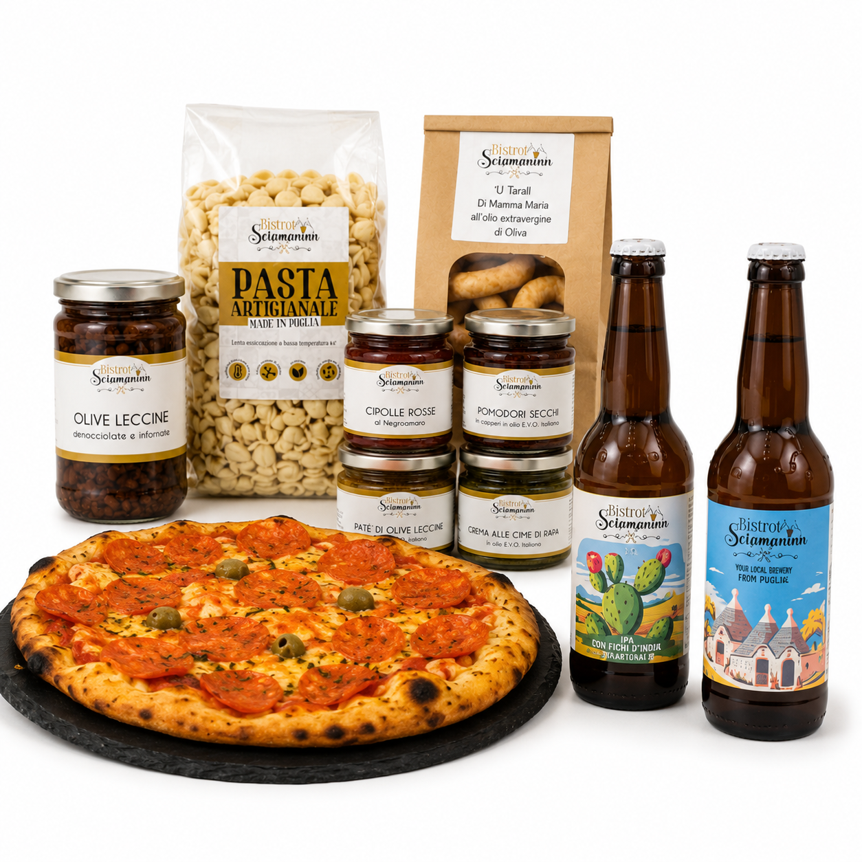 Box degustazione Bistrot Sciamaninn con pizza, birre artigianali, pasta, taralli, olive, creme e conserve su sfondo bianco